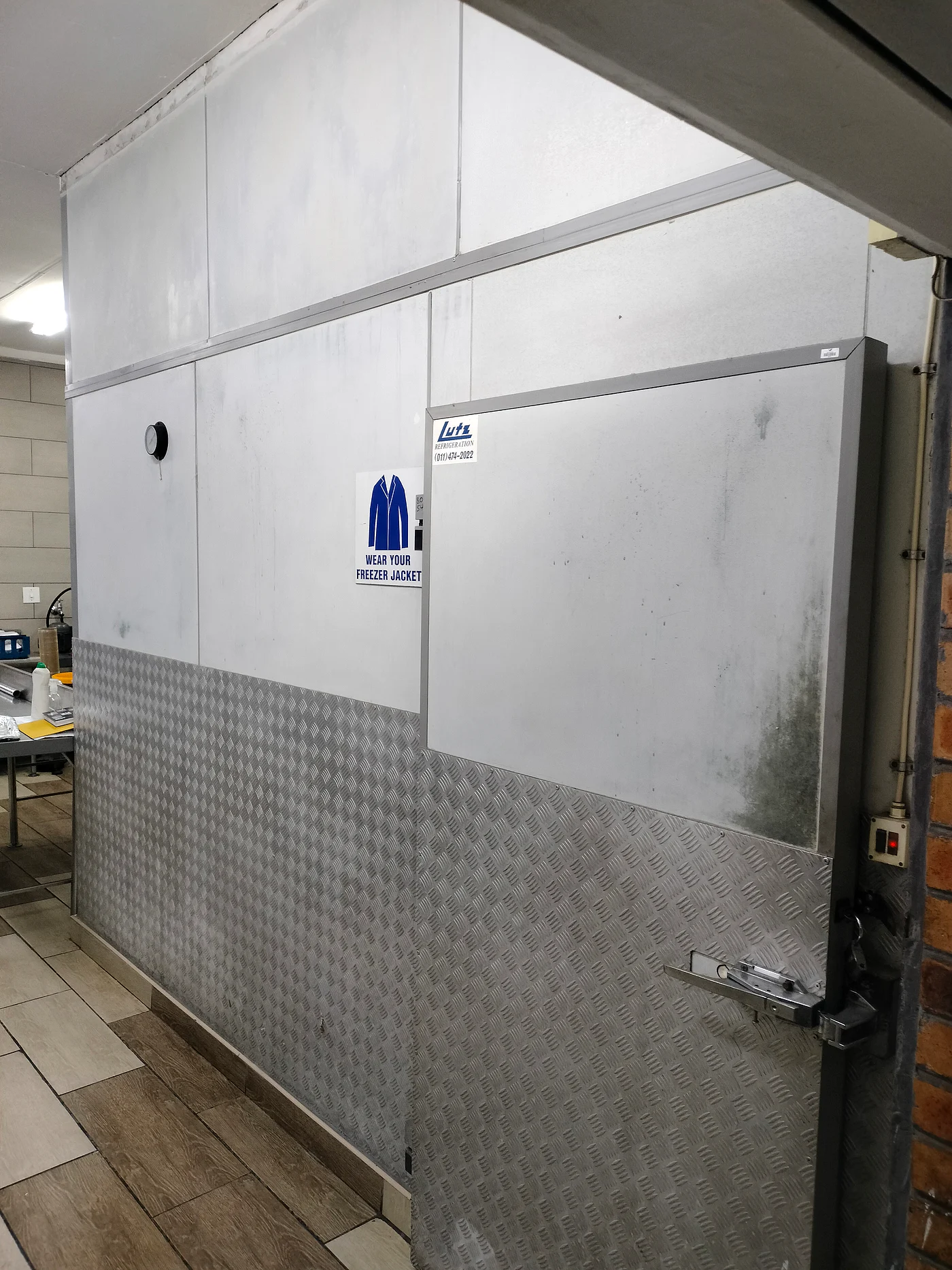 Commercial cold-room door with insulated wall panels